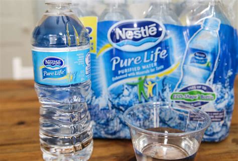 woman tests bottled water|best label for bottled water.